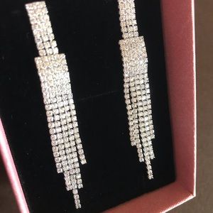 Sparkly dangling stud earrings with faux diamonds